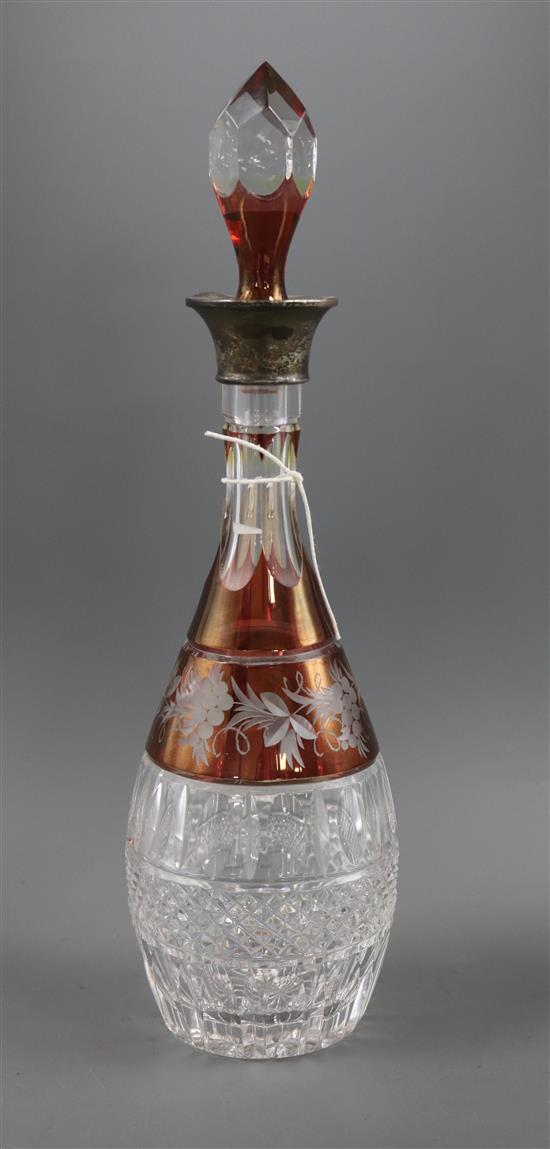 A cut and etched glass silver mounted decanter